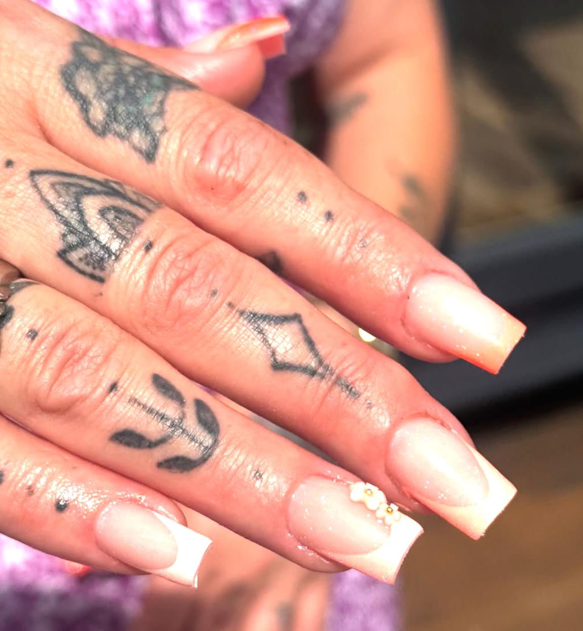 Detailed acrylic nail art by Design by Eva